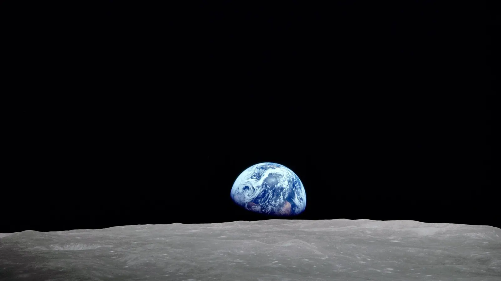 The Earth rising over the Moon's horizon, photographed from Apollo 8