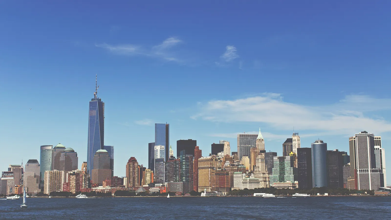 The Lower Manhattan skyline seen across New York Harbor on a clear day