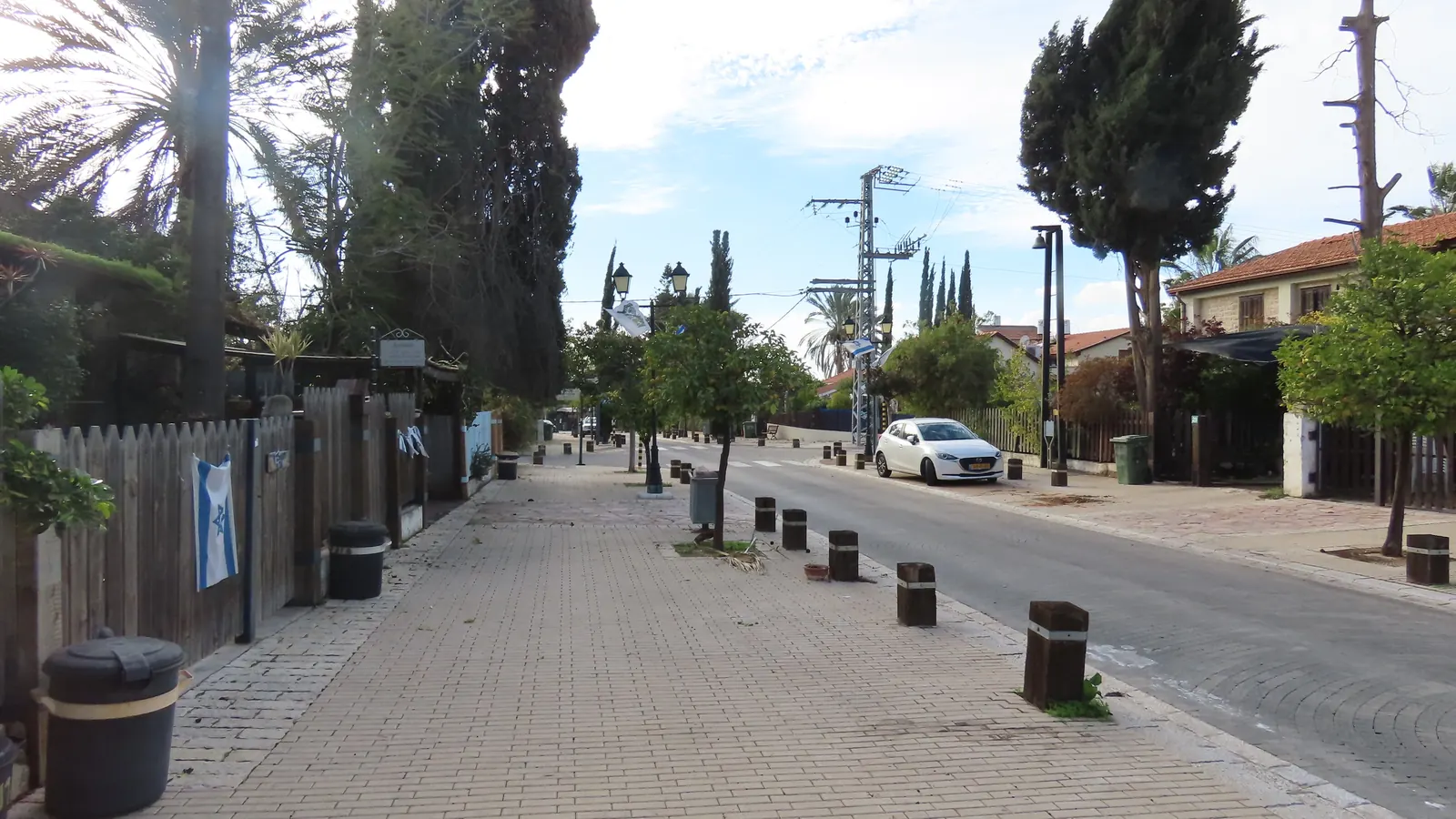 A quiet tree-lined street in the village of Mazkeret Batya, Israel